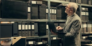 Man Tests GoBD-Compliant Archiving in an Archive